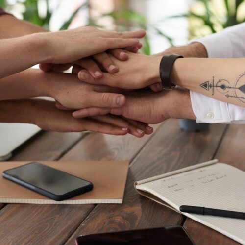 photo of people near wooden table